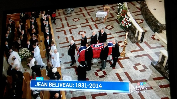 In this image taken from CTV News coverage, pallbearers who included Habs legends Guy Lafleur (top right) and Serge Savard (lower left) prepare to wheel Jean Béliveau's casket out of Mary, Queen of the World Cathedral after his funeral on Wednesday, Dec. 10. (Photo: CTV News/Jillian Page)